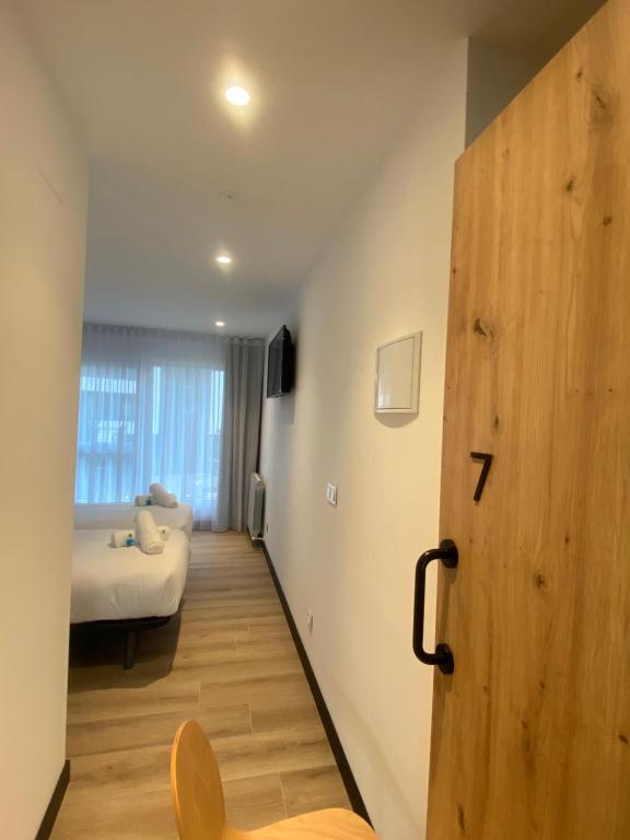 Postel nebo postele na pokoji v ubytování DONOSTIA ROOMS