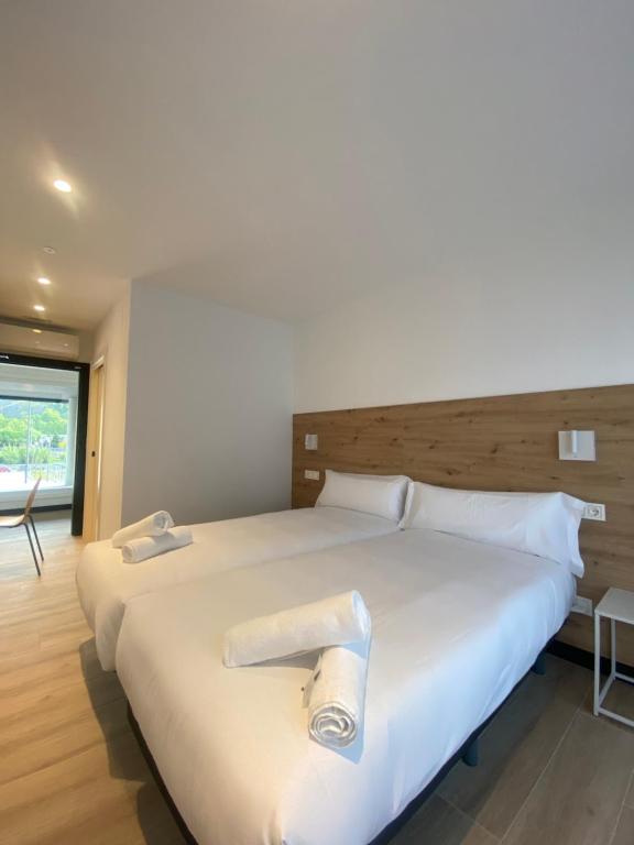 Postel nebo postele na pokoji v ubytování DONOSTIA ROOMS