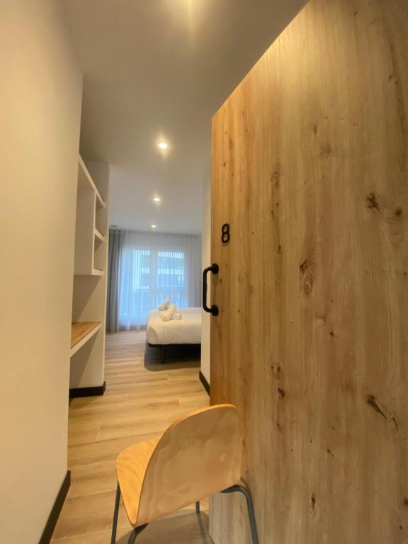 Postel nebo postele na pokoji v ubytování DONOSTIA ROOMS