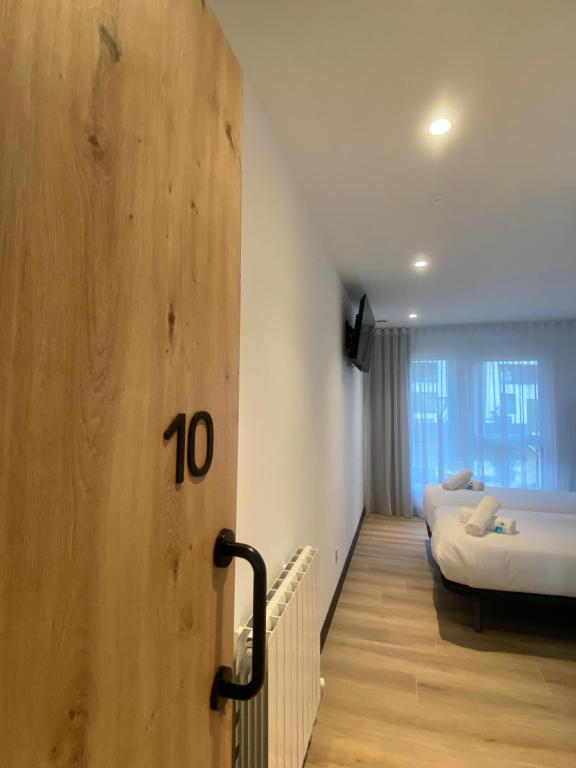 Postel nebo postele na pokoji v ubytování DONOSTIA ROOMS