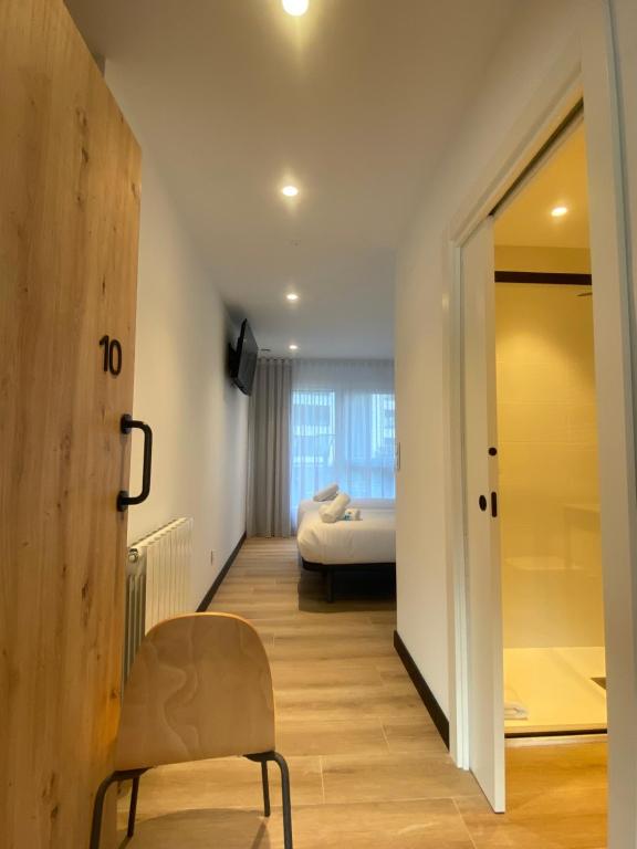 Postel nebo postele na pokoji v ubytování DONOSTIA ROOMS