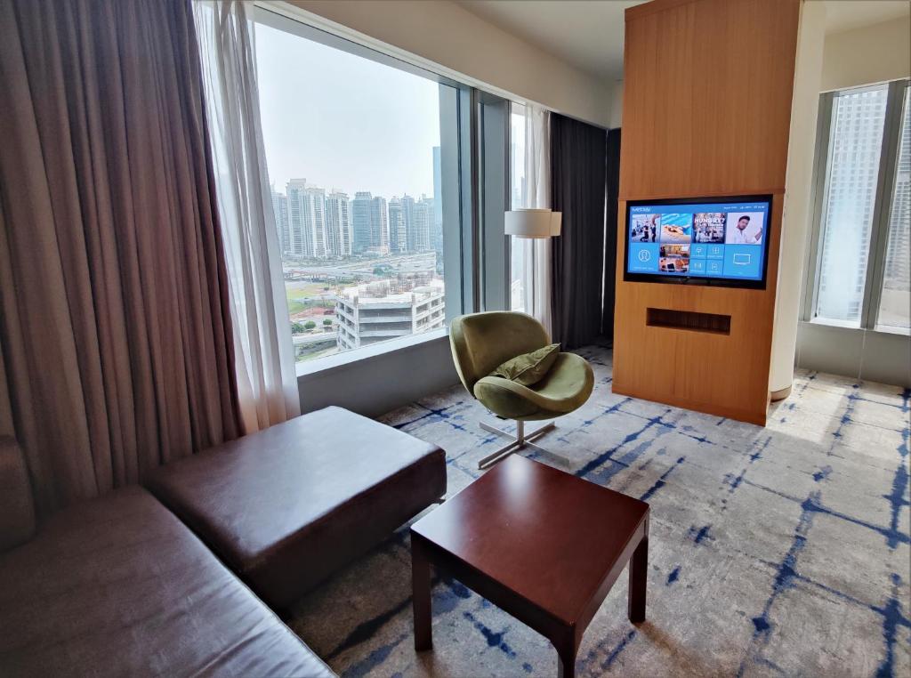 TV a/nebo společenská místnost v ubytování Media One Hotel
