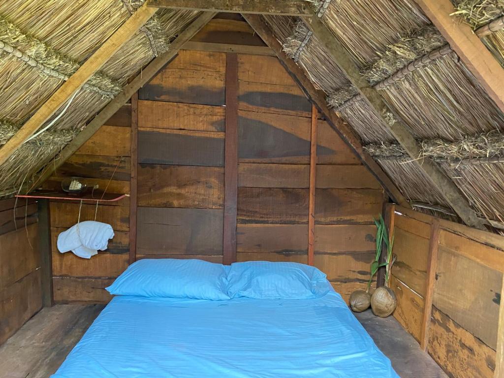 Кровать или кровати в номере Cabañitas Lahar y Dorms