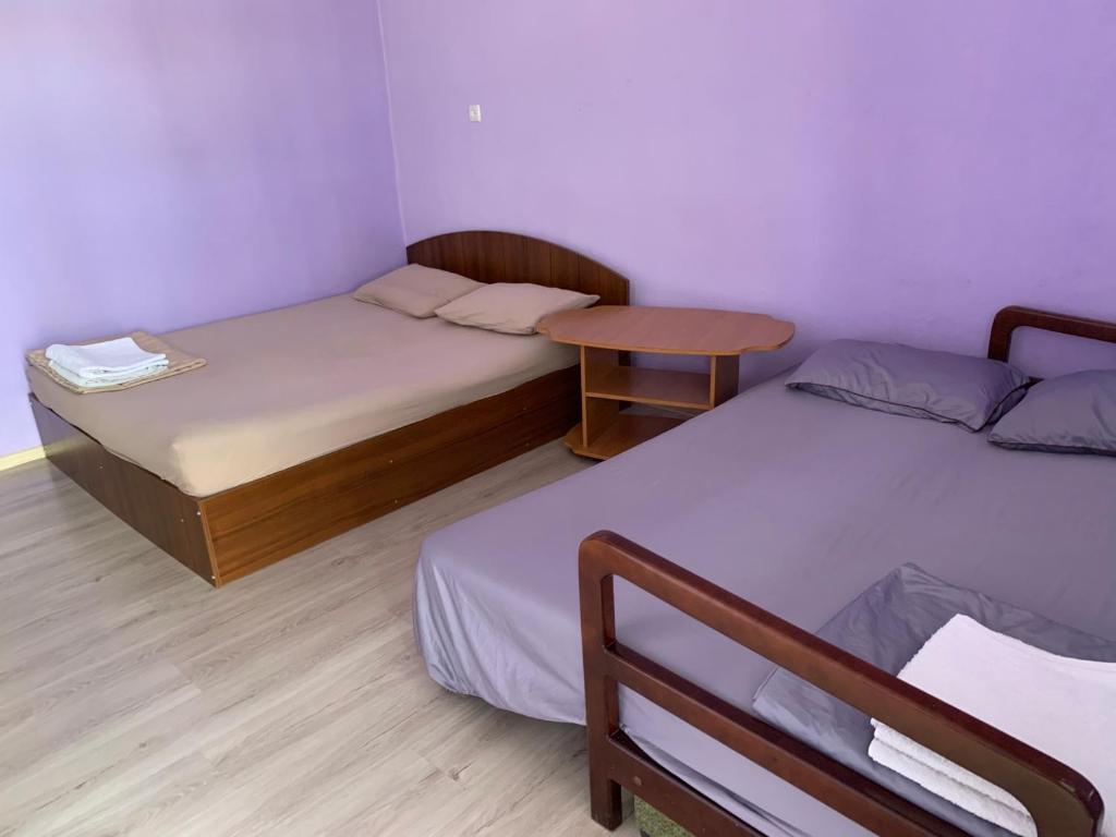 Postel nebo postele na pokoji v ubytování Гостиный Дом Comfort