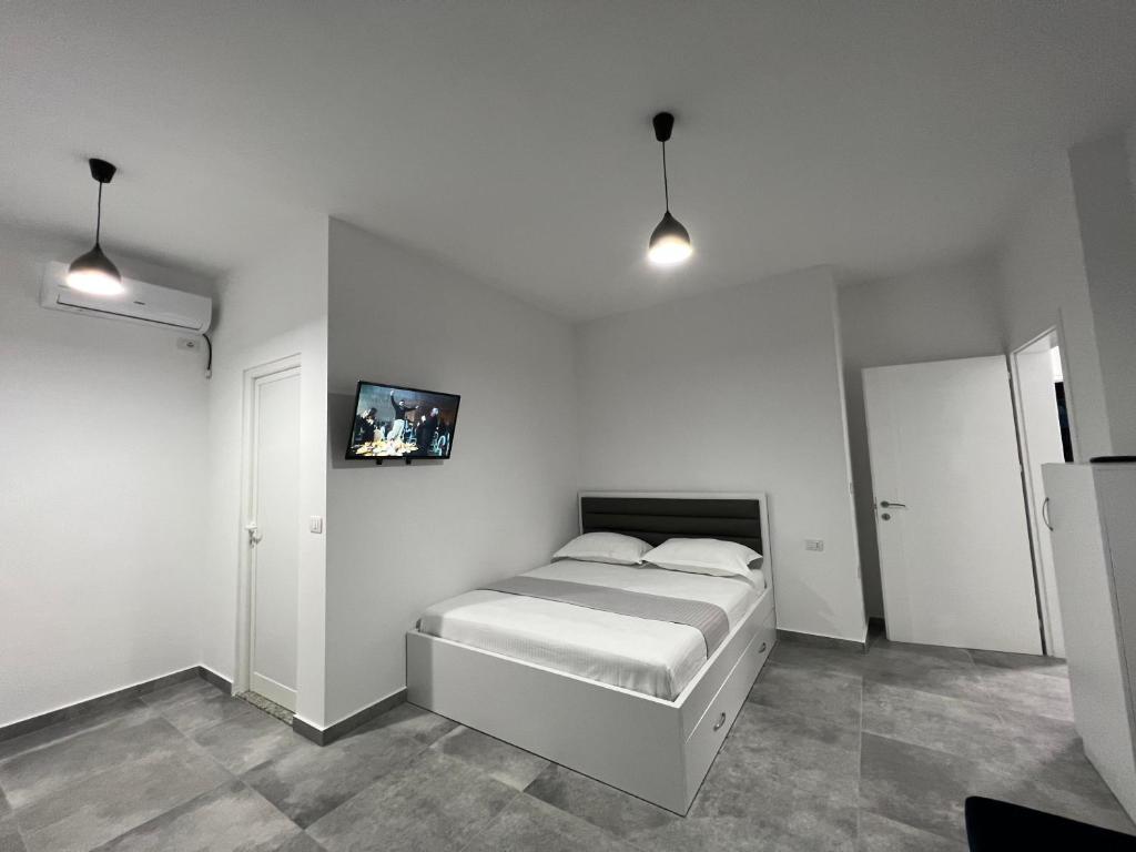 Postel nebo postele na pokoji v ubytování Vila Kledi