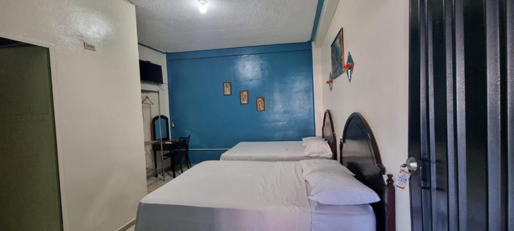 Postel nebo postele na pokoji v ubytování Hotel Los Andes Tegucigalpa