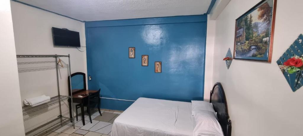 Postel nebo postele na pokoji v ubytování Hotel Los Andes Tegucigalpa