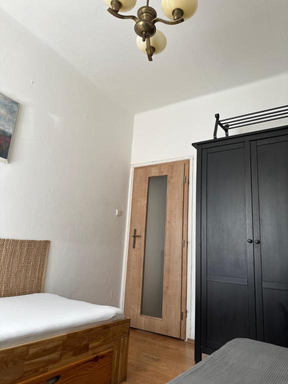 Łóżko lub łóżka w pokoju w obiekcie Apartments & Restaurant Tkalcovsky dvur