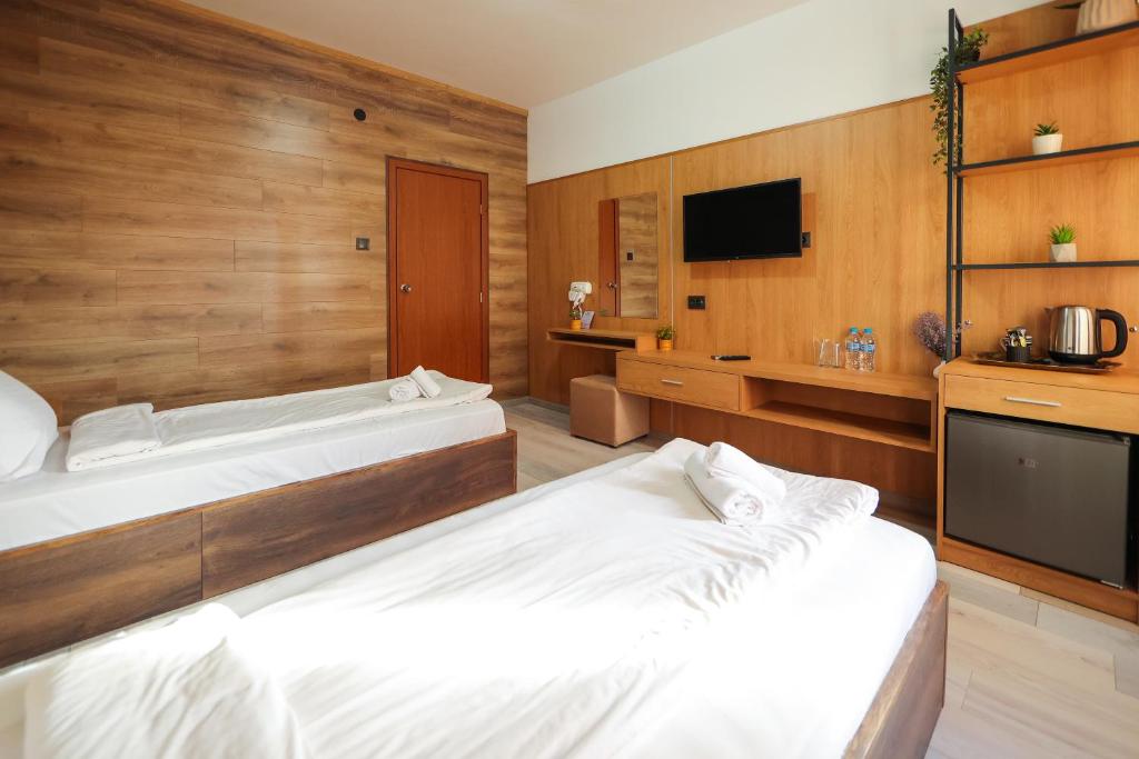 Postel nebo postele na pokoji v ubytování Family Hotel Gotse Delchev