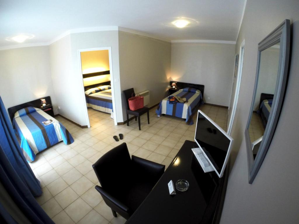 Postel nebo postele na pokoji v ubytování Hôtel Beach