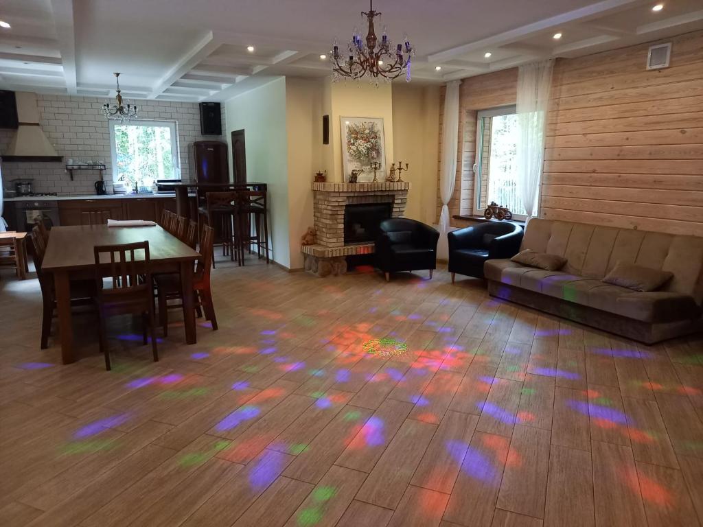 a living room with a floor with colored lights on it at Lesnoy holiday home in Vilnius