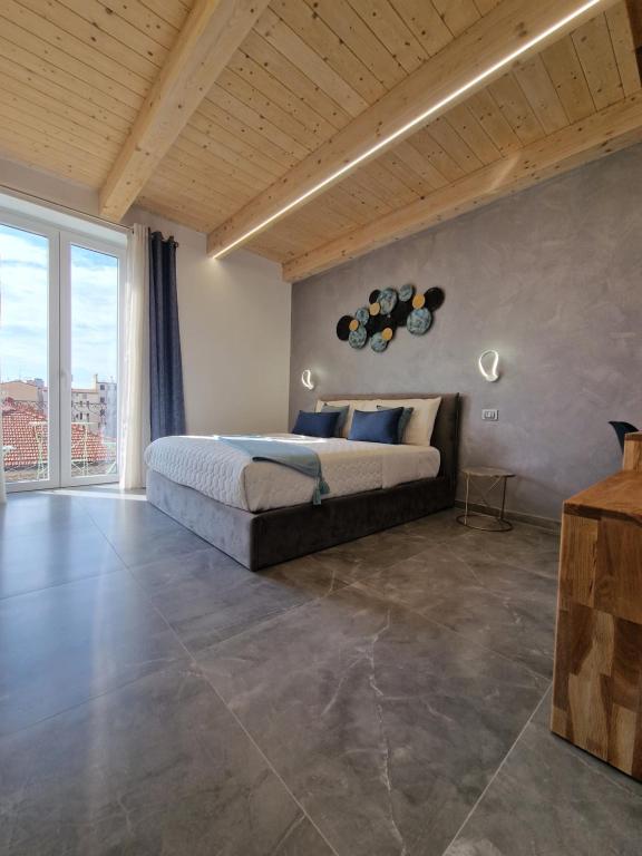 Postel nebo postele na pokoji v ubytování MARLA ROOMS