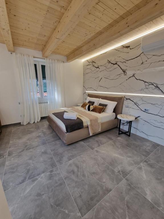 Postel nebo postele na pokoji v ubytování MARLA ROOMS