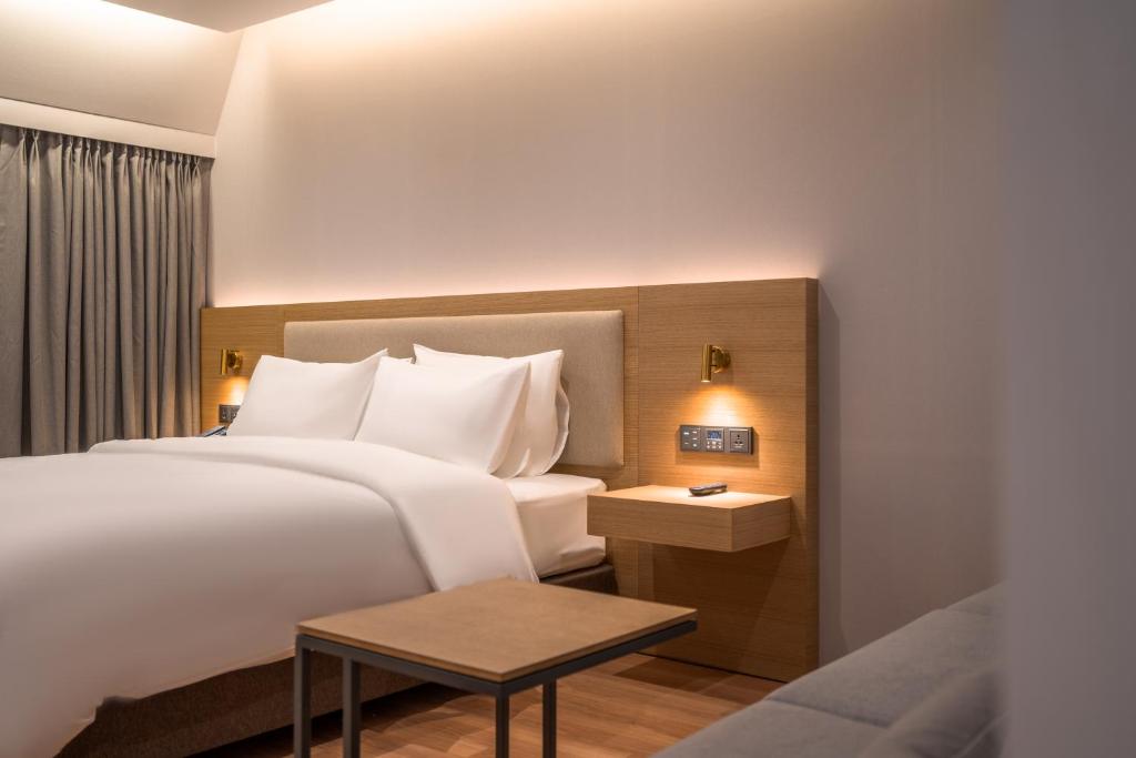 Postel nebo postele na pokoji v ubytování Comfort inn Yeouido