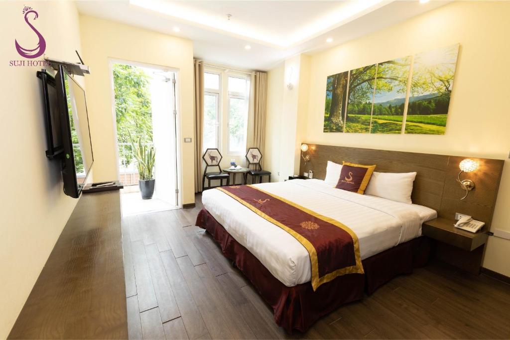 Giường trong phòng chung tại Suji My Dinh Hotel