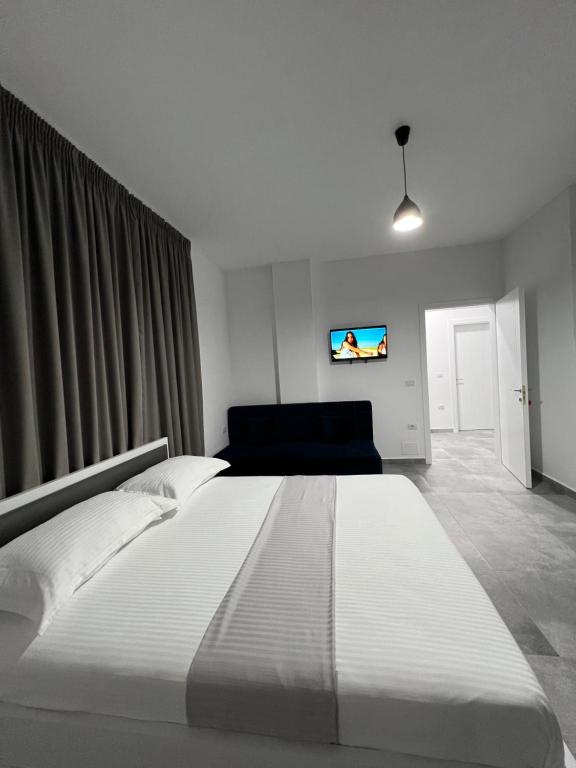 Postel nebo postele na pokoji v ubytování Vila Kledi