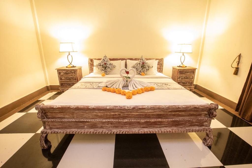 Postel nebo postele na pokoji v ubytování Arbathu Villa Ubud