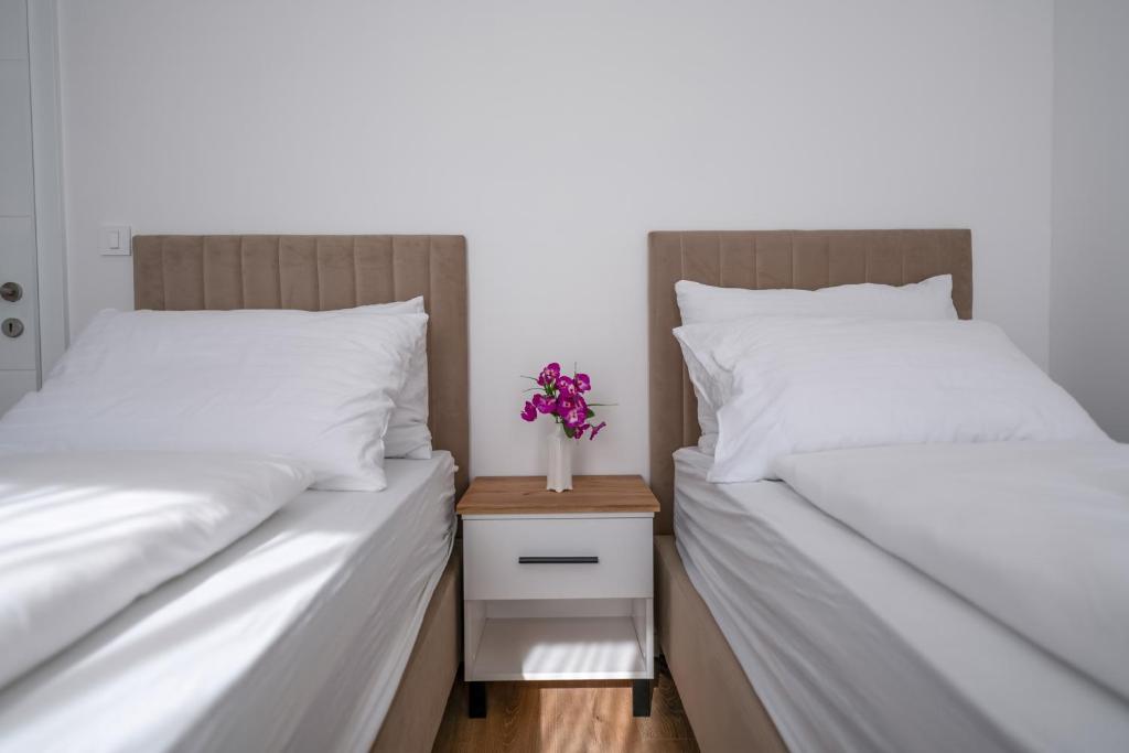 Postel nebo postele na pokoji v ubytování Hotel MM Residence