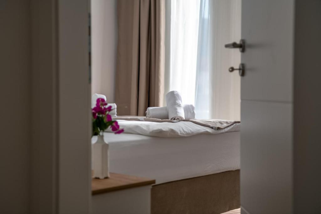 Postel nebo postele na pokoji v ubytování Hotel MM Residence