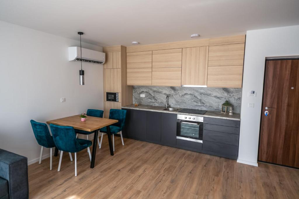 Kuchyň nebo kuchyňský kout v ubytování Hotel MM Residence