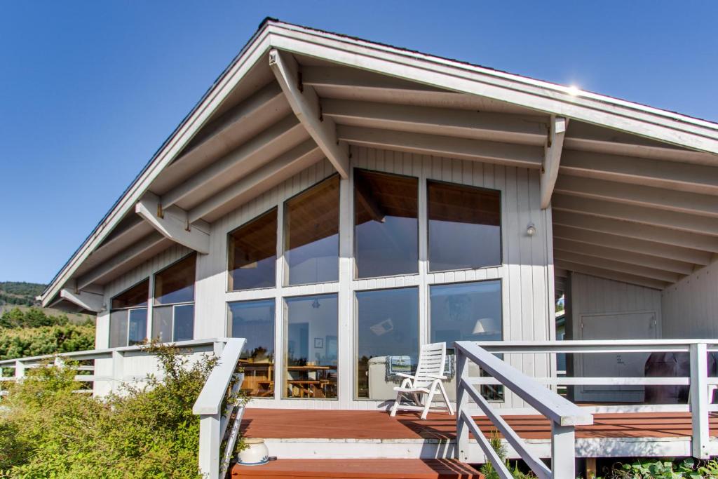 a house with large windows and a porch at Arthur's Court in Oceanside