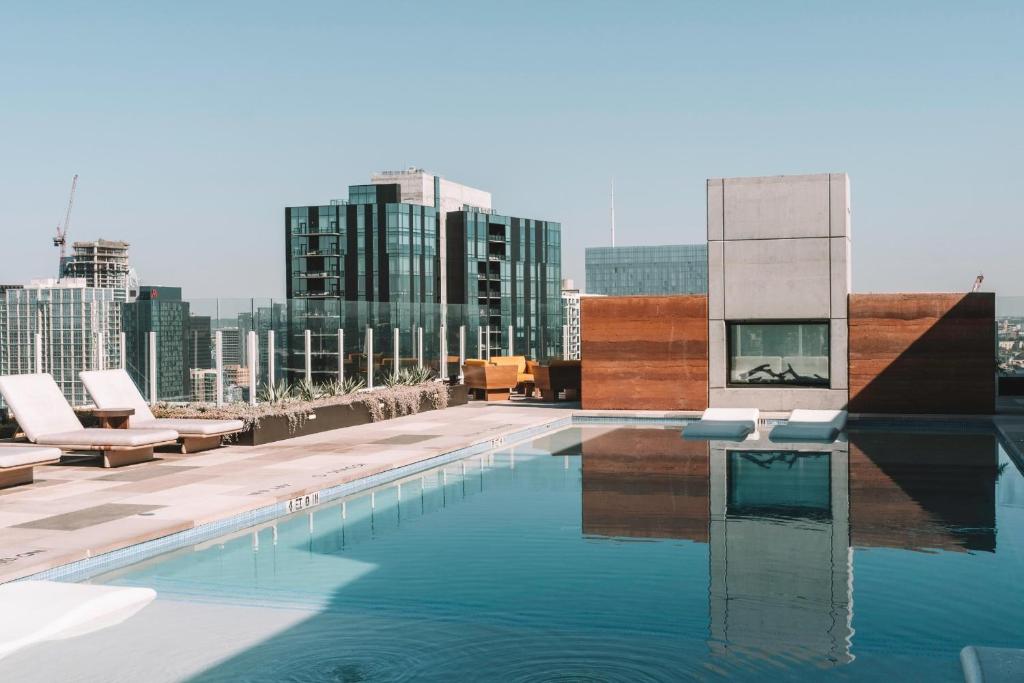 a swimming pool on the roof of a building at 2BD Condo-Rainey St-Best views-RT Pool in Austin