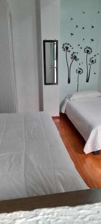 Postel nebo postele na pokoji v ubytování Hostal Brilliant