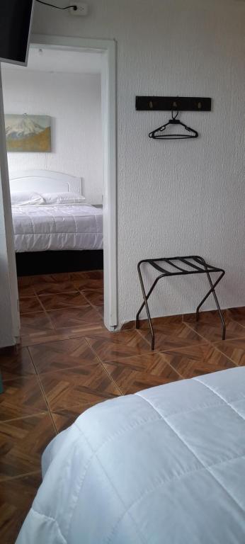 Postel nebo postele na pokoji v ubytování Hostal Brilliant