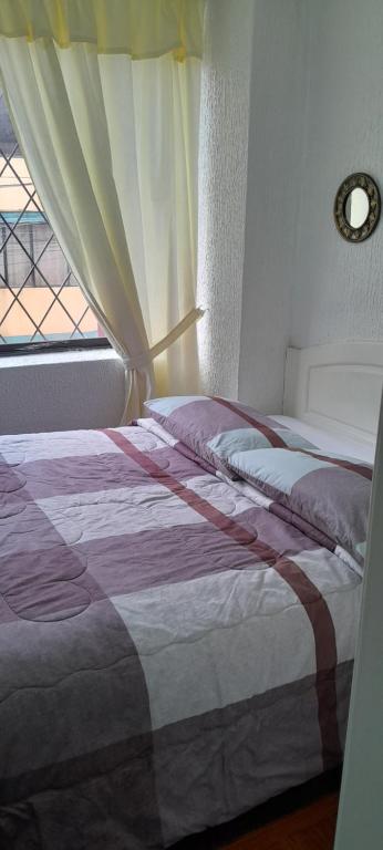 Postel nebo postele na pokoji v ubytování Hostal Brilliant
