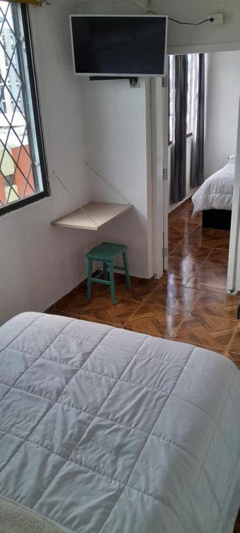 Postel nebo postele na pokoji v ubytování Hostal Brilliant
