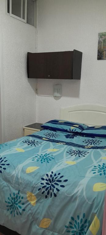Postel nebo postele na pokoji v ubytování Hostal Brilliant