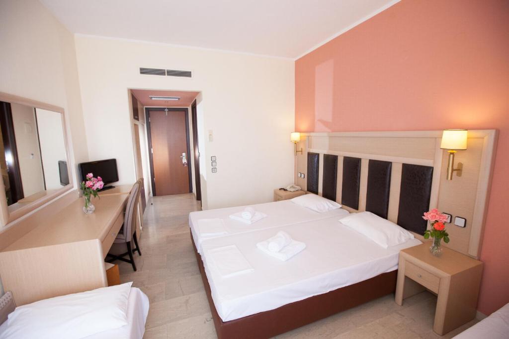Postel nebo postele na pokoji v ubytování Hotel Kanali