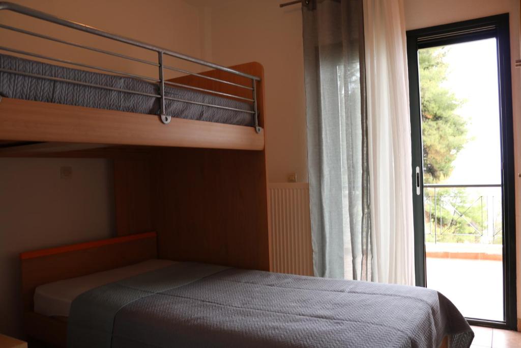 Postel nebo postele na pokoji v ubytování Thea Thalassa 1