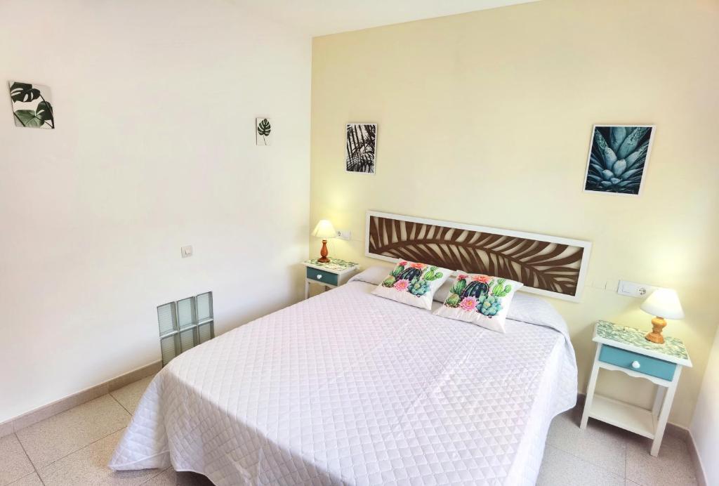 Postel nebo postele na pokoji v ubytování Hostal Noray