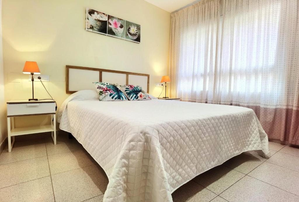 Postel nebo postele na pokoji v ubytování Hostal Noray