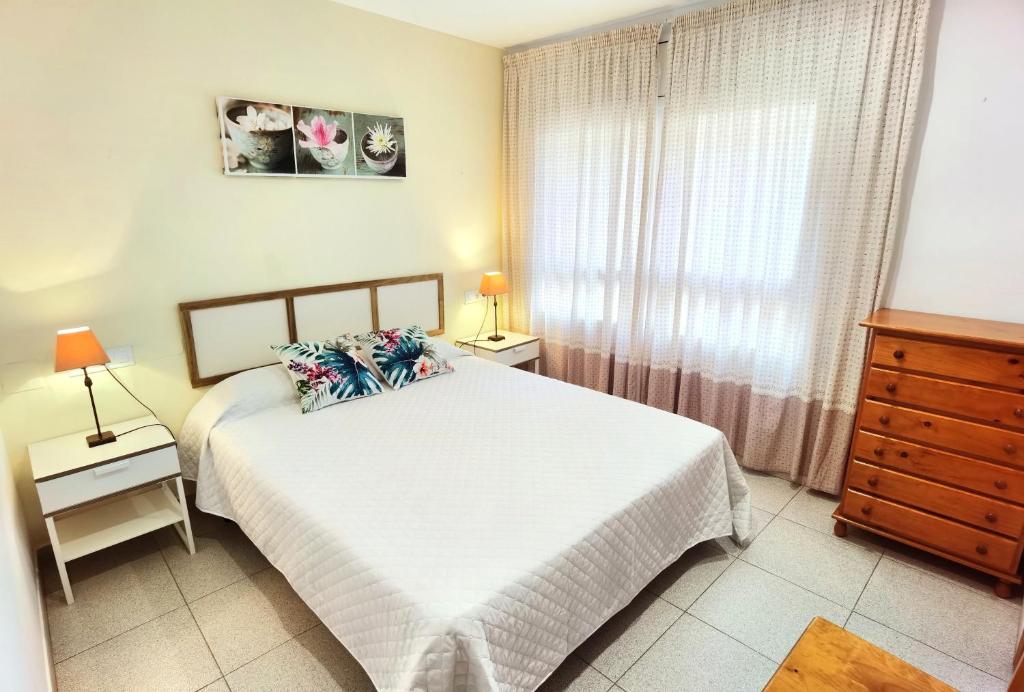 Postel nebo postele na pokoji v ubytování Hostal Noray