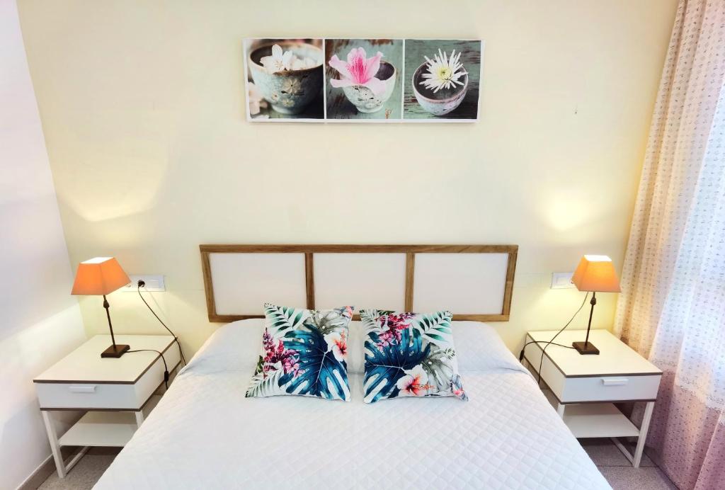 Postel nebo postele na pokoji v ubytování Hostal Noray
