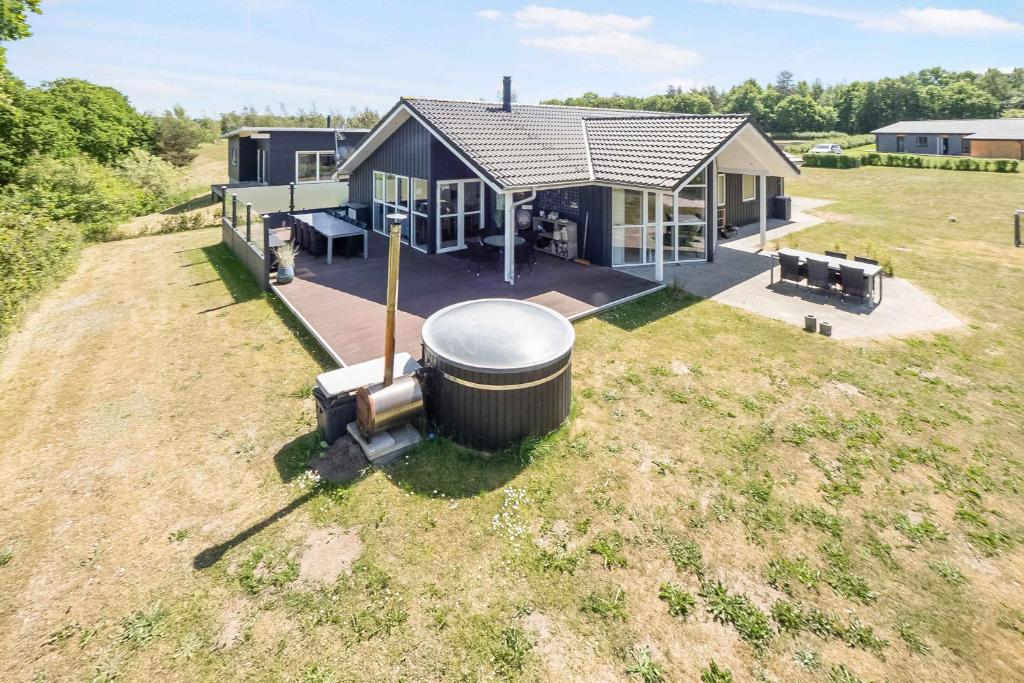 an overhead view of a house with a large tank at Stokholms Sommerhus in Skals