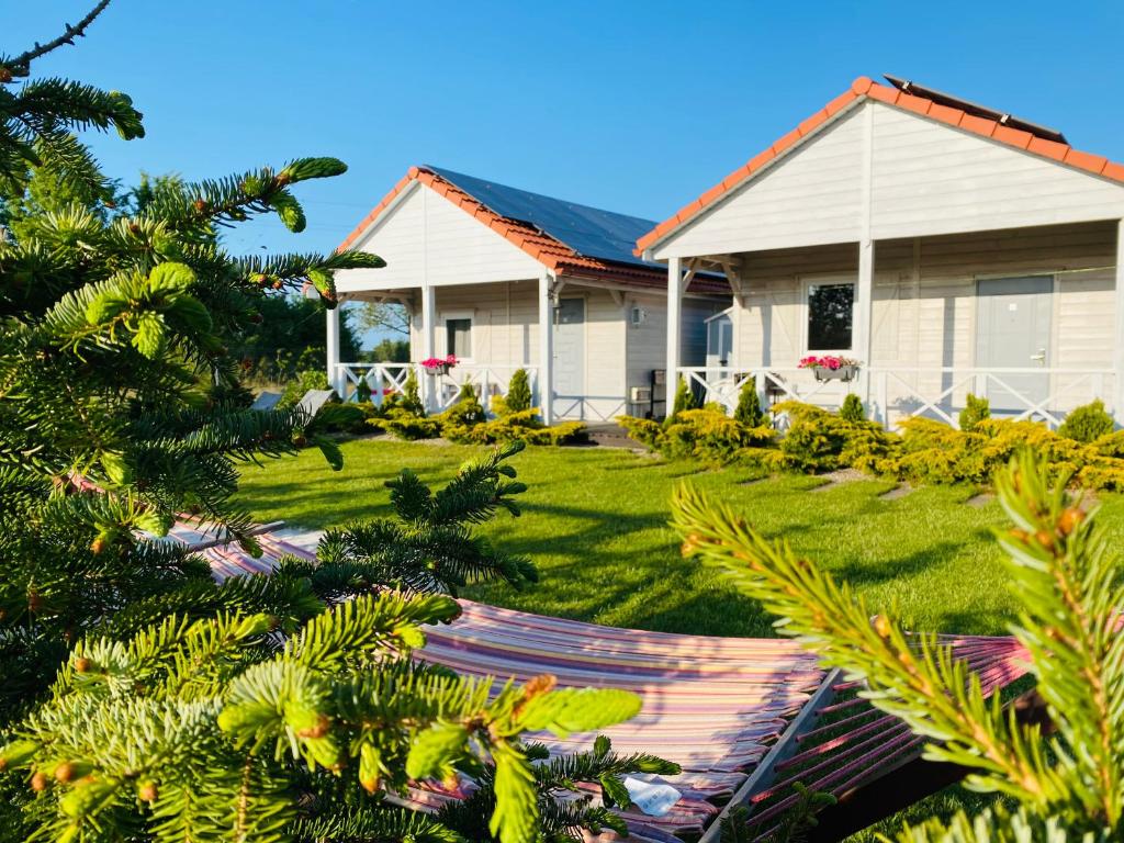 a house with a lawn in front of it at Siedlisko Wytowno in Ustka