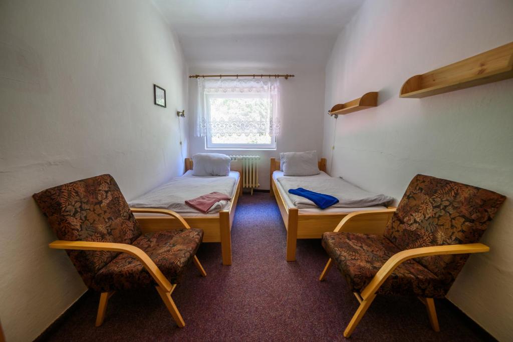 Postel nebo postele na pokoji v ubytování Chata Čeňkovka