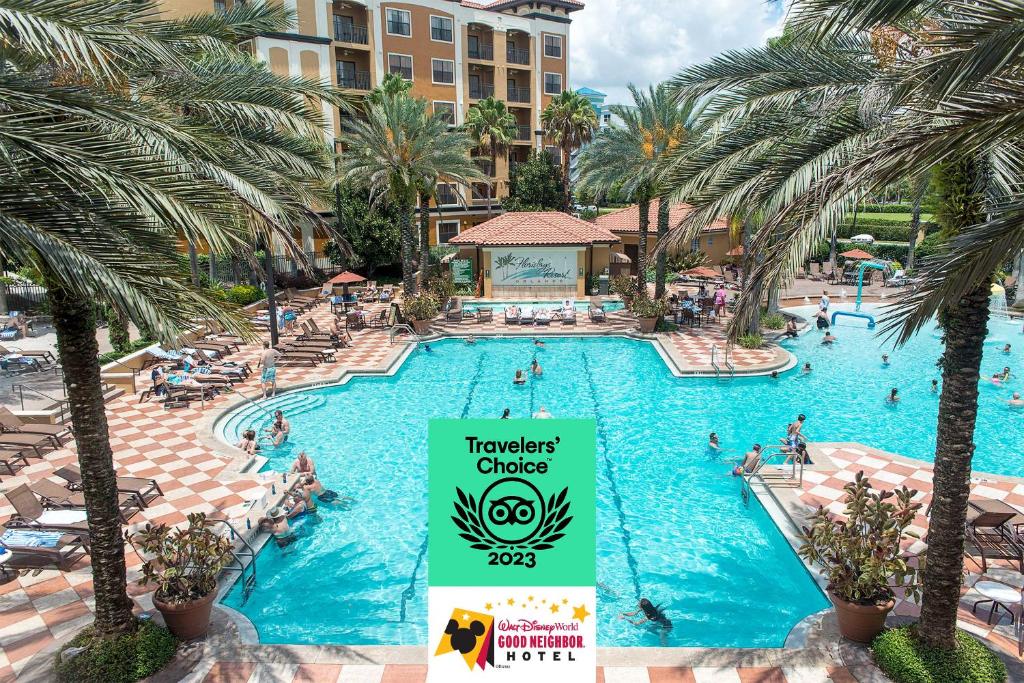 a view of a pool at a resort with a sign that reads traveler cues at Floridays Orlando Two & Three Bed Rooms Condo Resort in Orlando