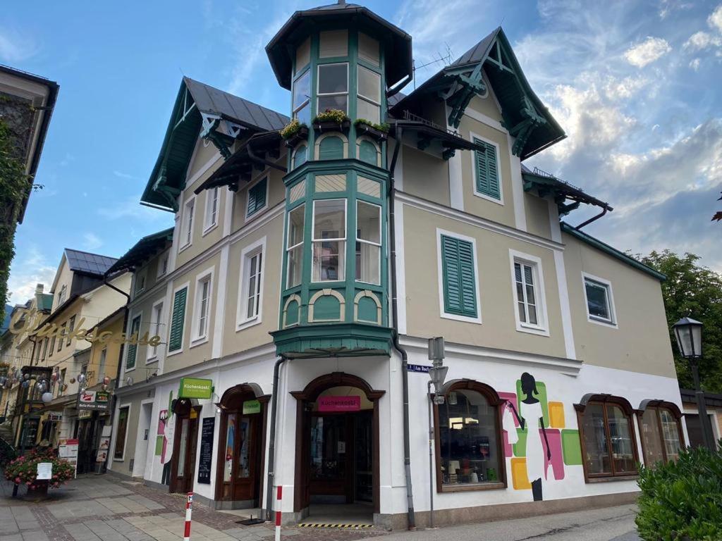 a large building with a tower on a street at Zentrale Lage in Bad Ischl - Top 2 in Bad Ischl