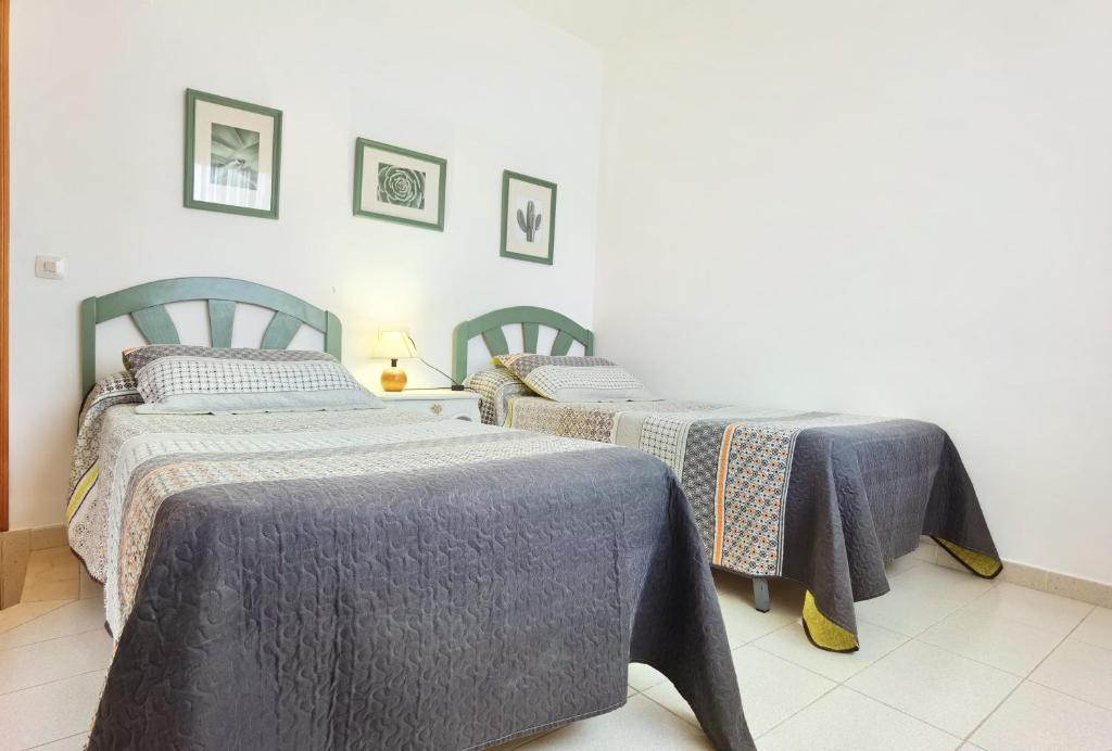 Postel nebo postele na pokoji v ubytování Hostal Noray