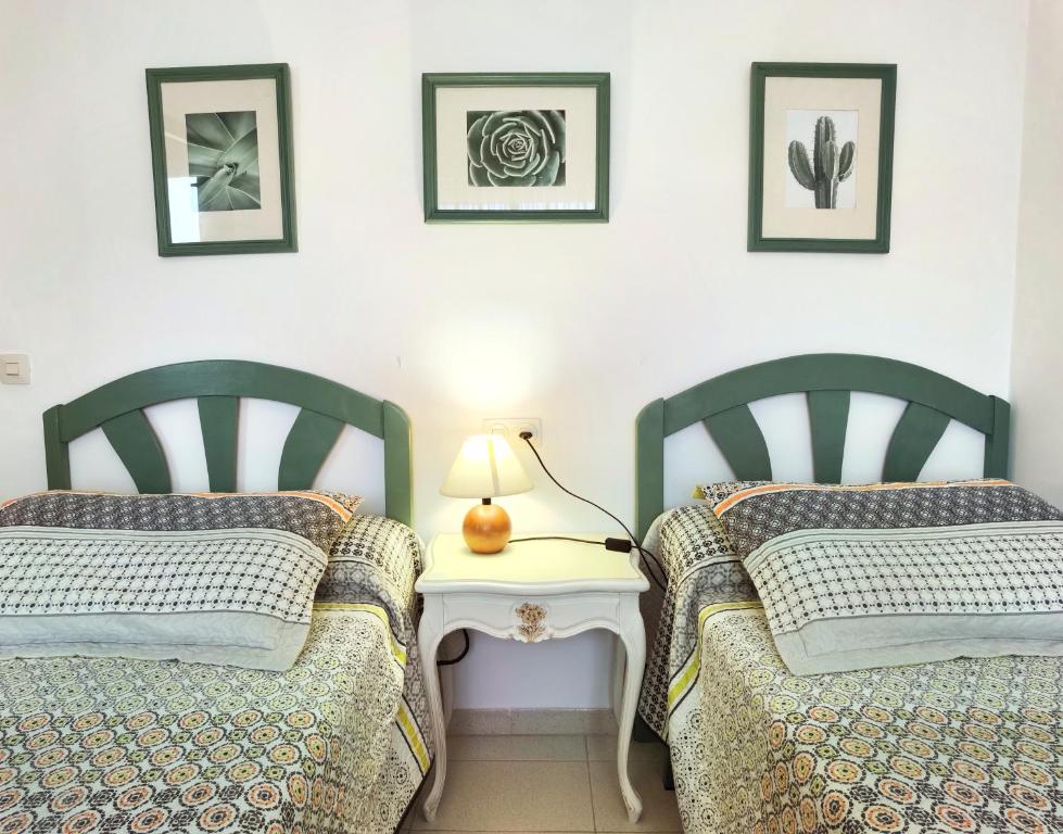 Postel nebo postele na pokoji v ubytování Hostal Noray