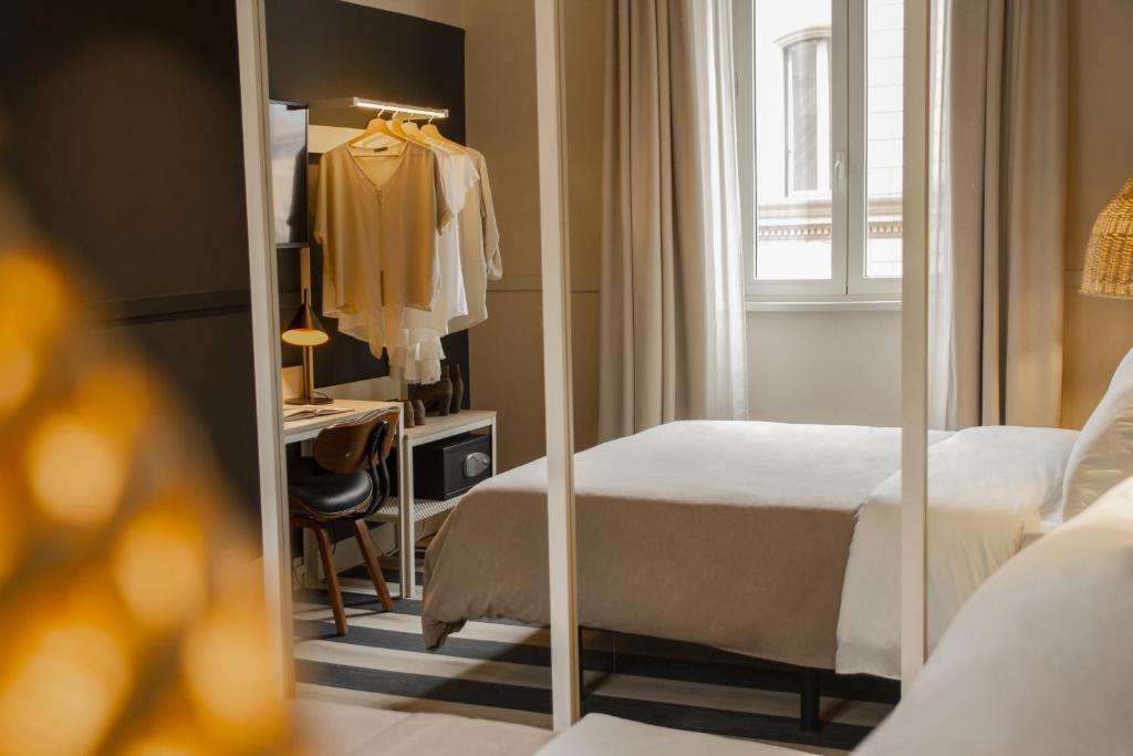 Postel nebo postele na pokoji v ubytování room Select Via Veneto