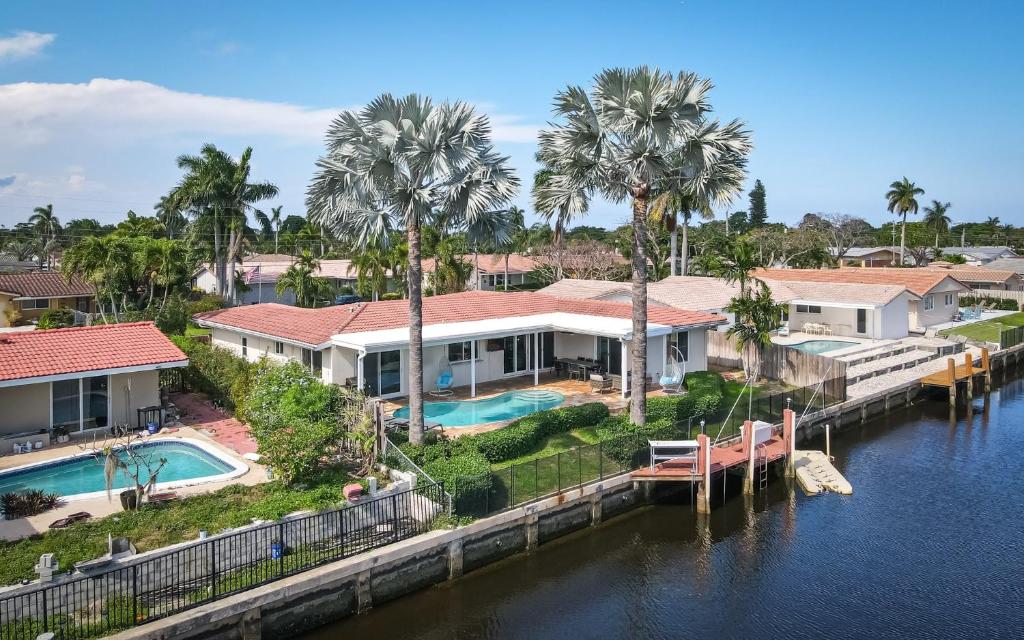 an aerial view of a house on the water at Dockside Daydreams - Canalfront and Pool Oasis in Fort Lauderdale