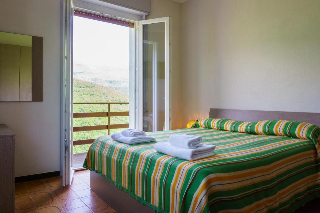 Postel nebo postele na pokoji v ubytování Albergo ristorante Payarin