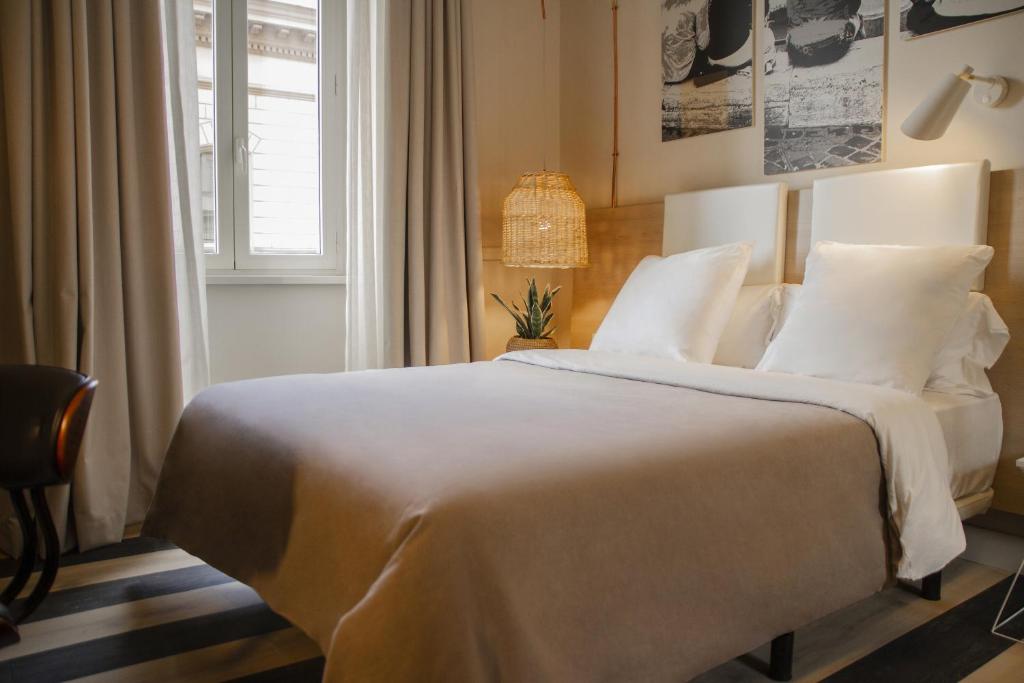 Postel nebo postele na pokoji v ubytování room Select Via Veneto