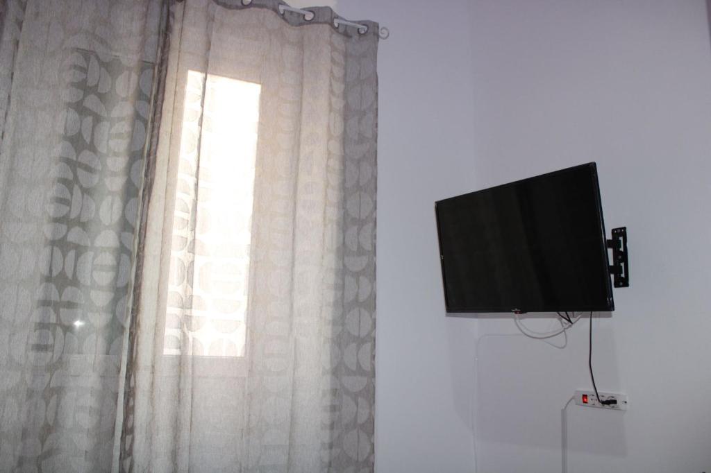 TV a/nebo společenská místnost v ubytování Dolce Notte