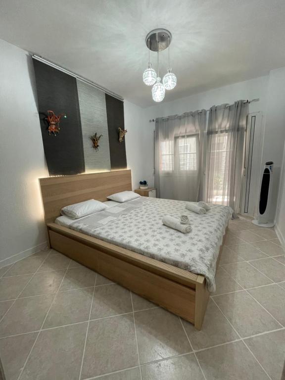 a bedroom with a large bed in a room at Comfy Myrvalis Apartment in Agia Triada